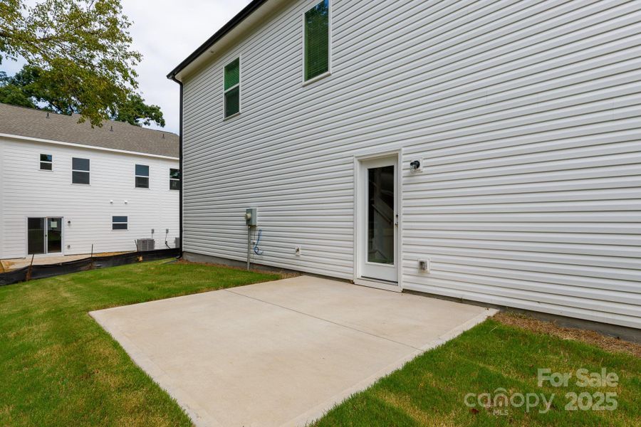 Front exterior of a new home in , Charlotte, NC, highlighting curb appeal (Image 1).