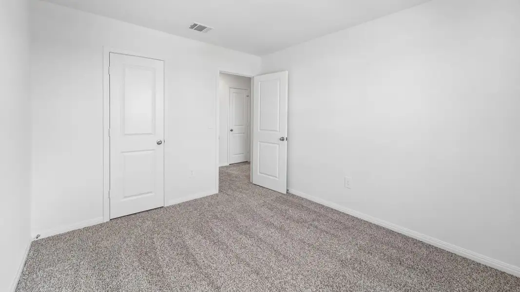 Spacious, unfurnished interior of a new home in Bar W Ranch, Leander (Image 27).