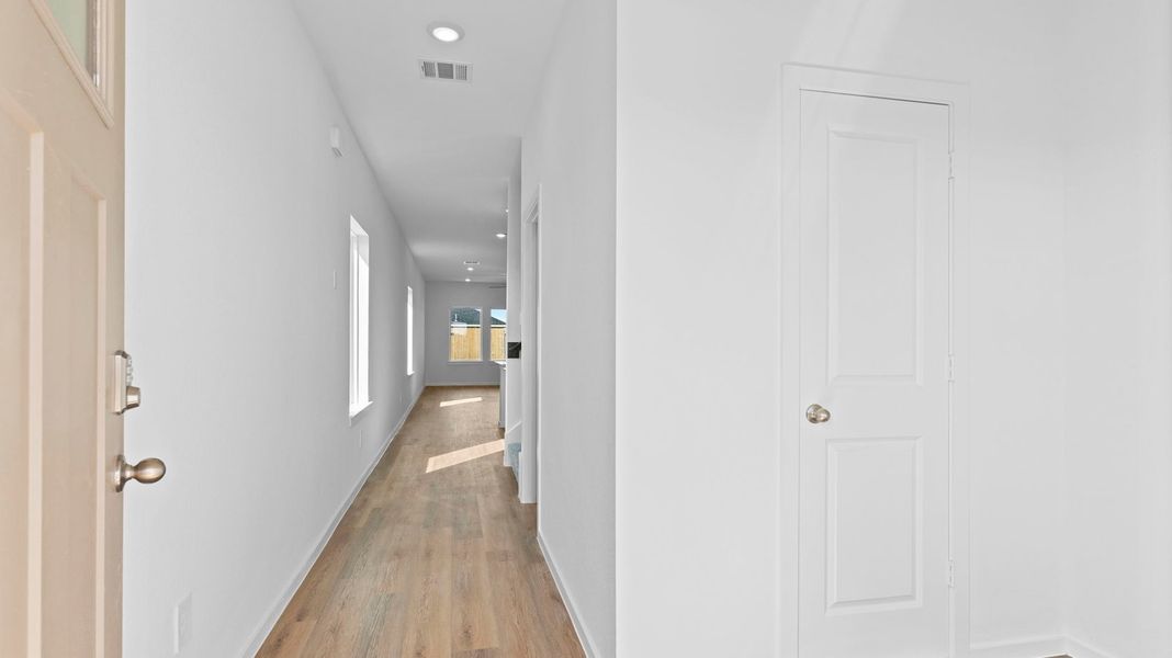 Representative unfurnished interior of a home built from the Hanna by D.R. Horton in Caldwell Crossing, Iowa Colony (Image 13).