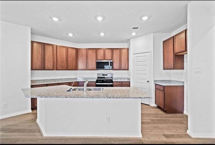 Furnished interior view inside a new home in Sunterra, Katy (Image 8).