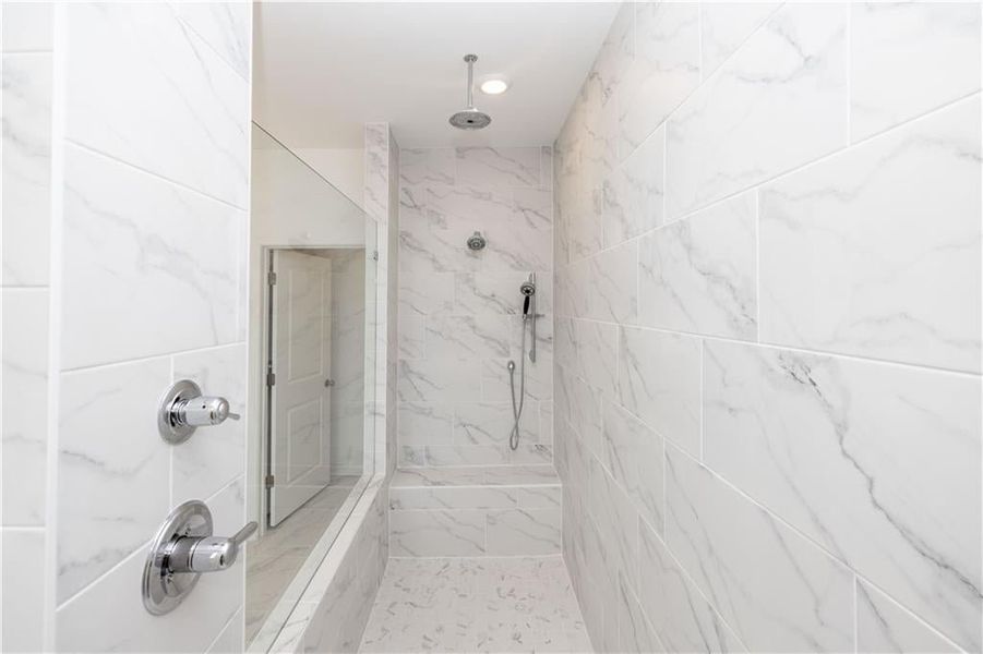 Gorgeous shower - sit down bench as well - Pictures represent a previously built home