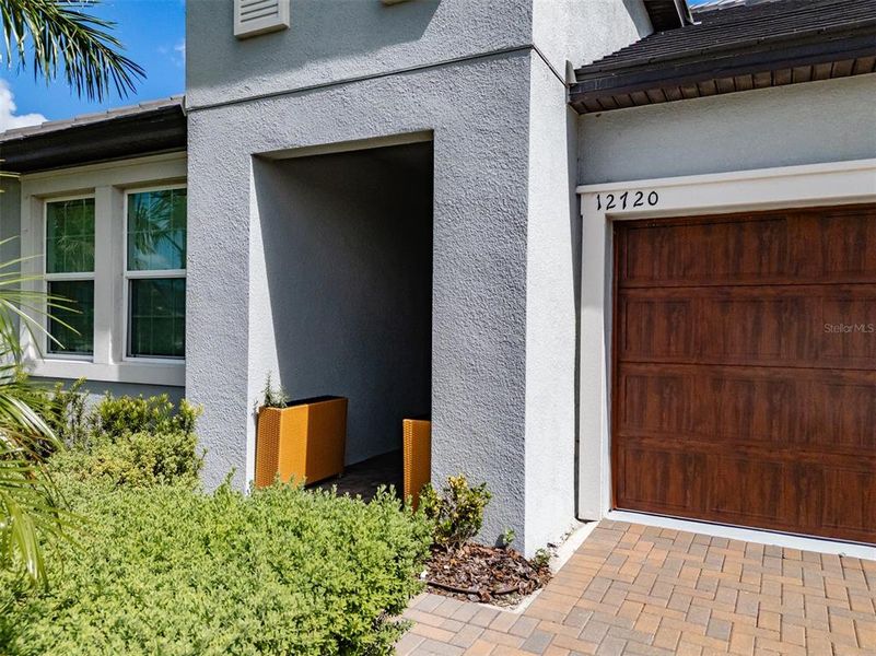 Exterior details and patio area of a home in Prosperity Lakes, Parrish (Image 30).