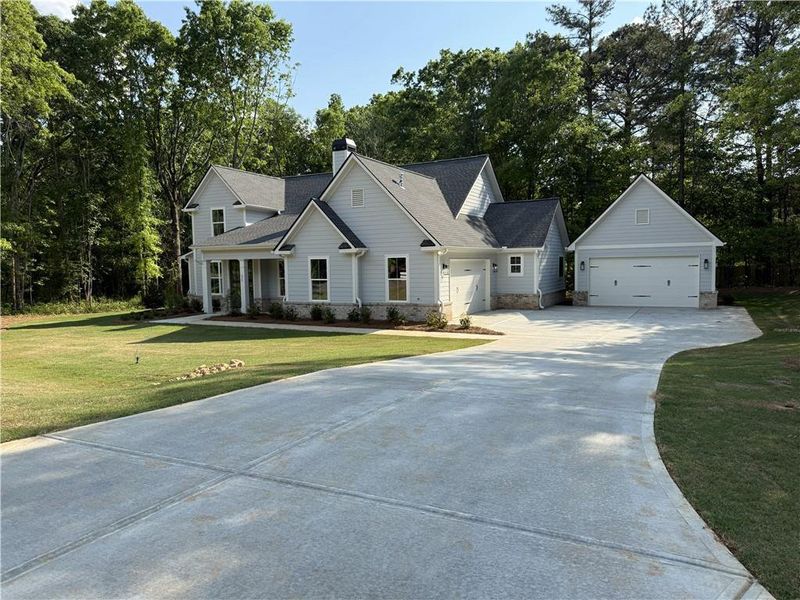 Front exterior of a new home in , Monroe, GA, highlighting curb appeal (Image 14).