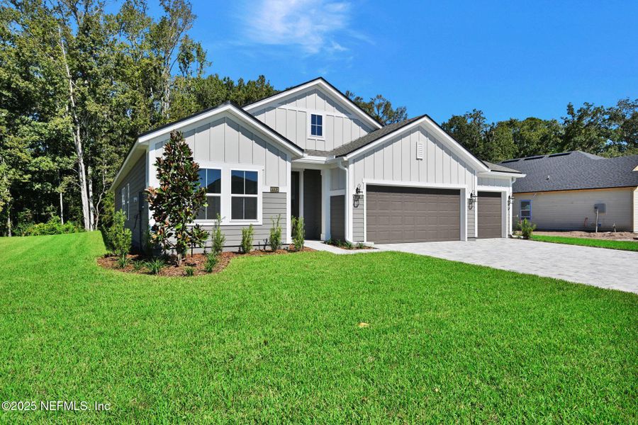Front exterior of a new home in McGirt's Creek, Yulee, FL, highlighting curb appeal (Image 2).