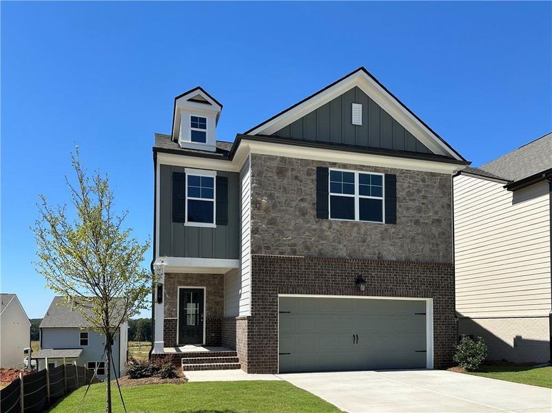 Front exterior of a new home in Kentmere, Auburn, GA, highlighting curb appeal (Image 26). Front exterior of a new home in Kentmere, Auburn, GA, highlighting curb appeal (Image 26).