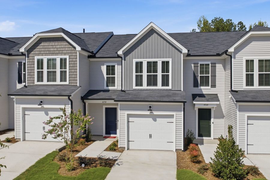 Front exterior of a new home in Carpenter Falls, Durham, NC, highlighting curb appeal (Image 27). Front exterior of a new home in Carpenter Falls, Durham, NC, highlighting curb appeal (Image 27).