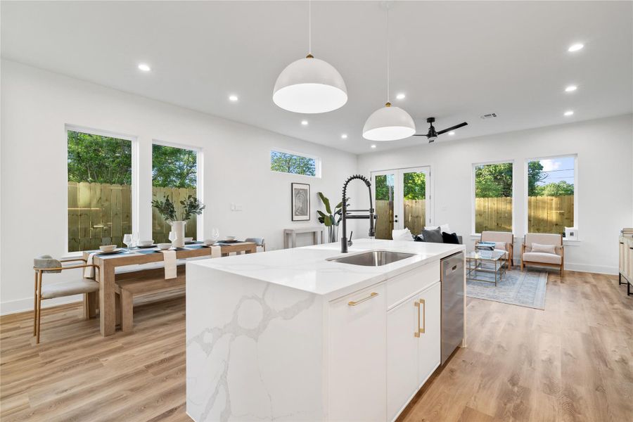 The space seamlessly connects to the dining area and kitchen, creating a perfect flow for entertaining The space seamlessly connects to the dining area and kitchen, creating a perfect flow for entertaining
