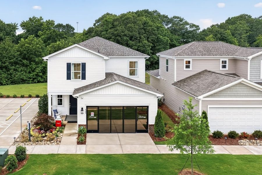 Front exterior of a new home in Fincastle Glen, Shelby, NC, highlighting curb appeal (Image 2). Front exterior of a new home in Fincastle Glen, Shelby, NC, highlighting curb appeal (Image 2).
