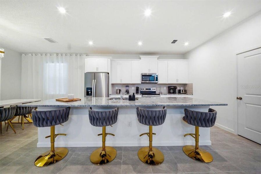 Furnished interior view inside a new home in Solara Resort, Kissimmee (Image 4).