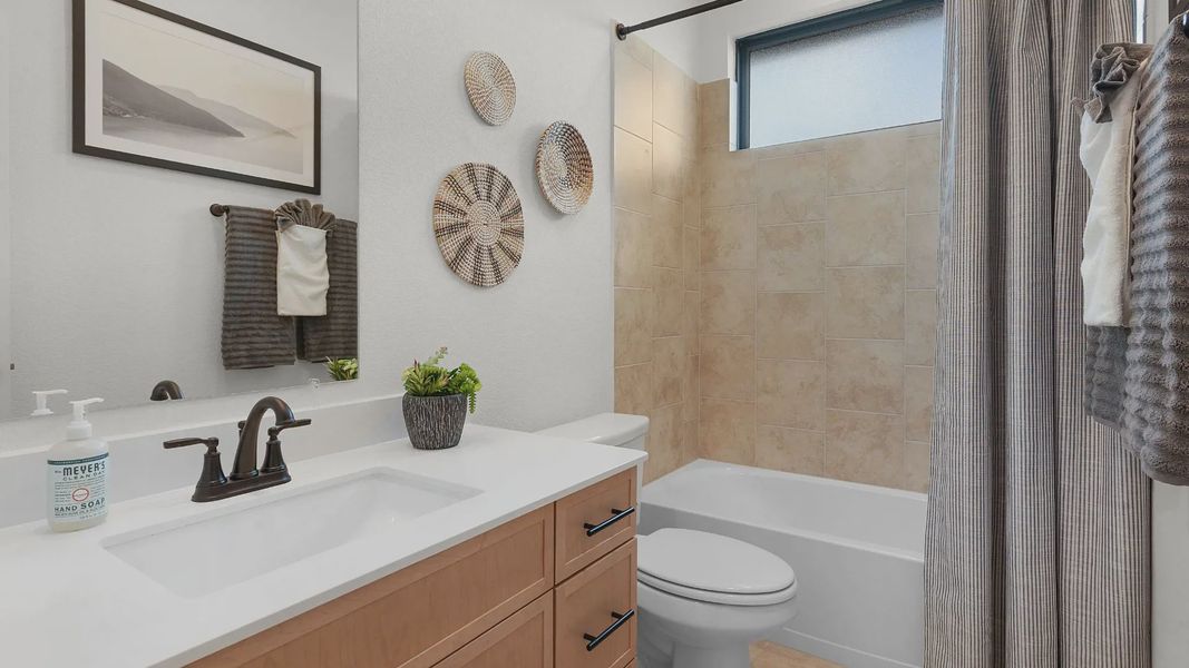 Representative furnished interior of a home built from the Mariah by Chesmar Homes in University Heights, Round Rock (Image 6).