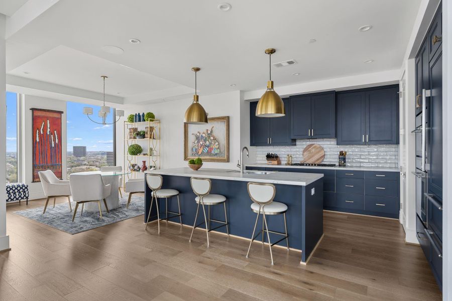 There is a quiet power in a blue kitchen, especially when it’s perched fifty stories up. It provides a cool, contemporary weight to the light-drenched breakfast room and living area, acting as a structural anchor that pulls the whole floor plan together. The matte blue finish softens the industrial edges of high-rise glass, creating a space that feels both cutting-edge and incredibly serene. It’s where the precision of modern design meets the calming palette of the atmosphere There is a quiet power in a blue kitchen, especially when it’s perched fifty stories up. It provides a cool, contemporary weight to the light-drenched breakfast room and living area, acting as a structural anchor that pulls the whole floor plan together. The matte blue finish softens the industrial edges of high-rise glass, creating a space that feels both cutting-edge and incredibly serene. It’s where the precision of modern design meets the calming palette of the atmosphere