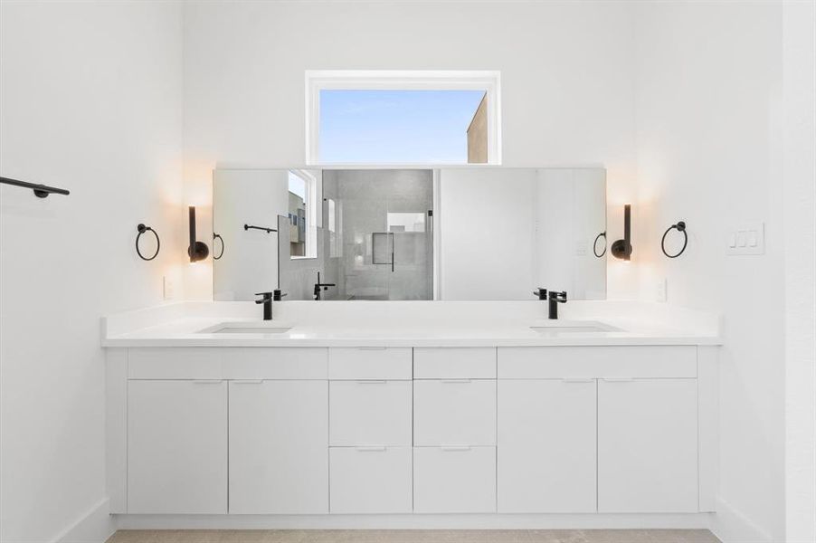 Spacious double-sink vanity in the primary suite bath.