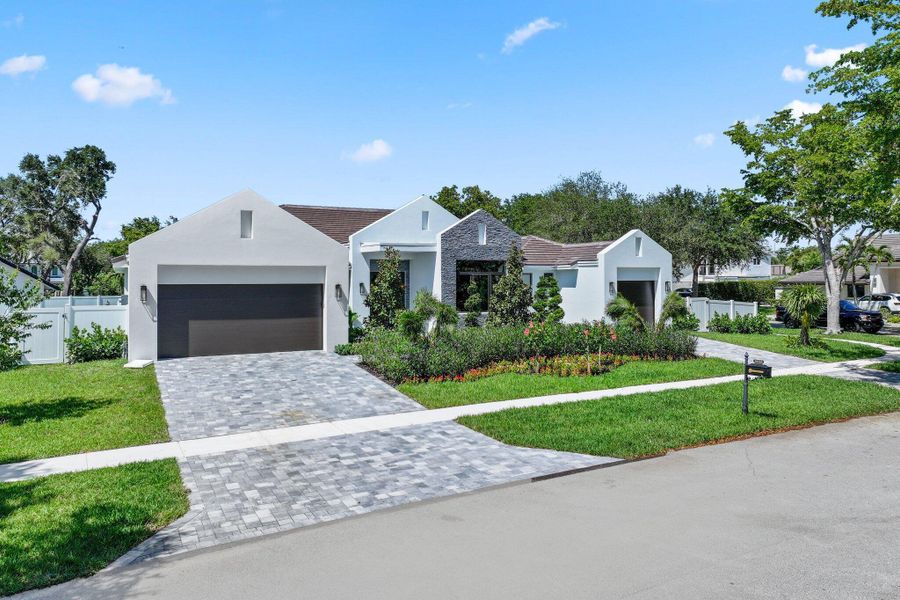 Front exterior of a new home in , Boca Raton, FL, highlighting curb appeal (Image 2). Front exterior of a new home in , Boca Raton, FL, highlighting curb appeal (Image 2).