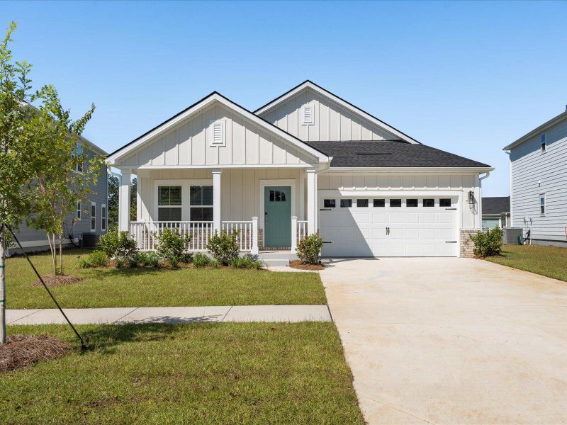 Front exterior of a new home in The Coves at Lakes of Cane Bay, Summerville, SC, highlighting curb appeal (Image 28). Front exterior of a new home in The Coves at Lakes of Cane Bay, Summerville, SC, highlighting curb appeal (Image 28).