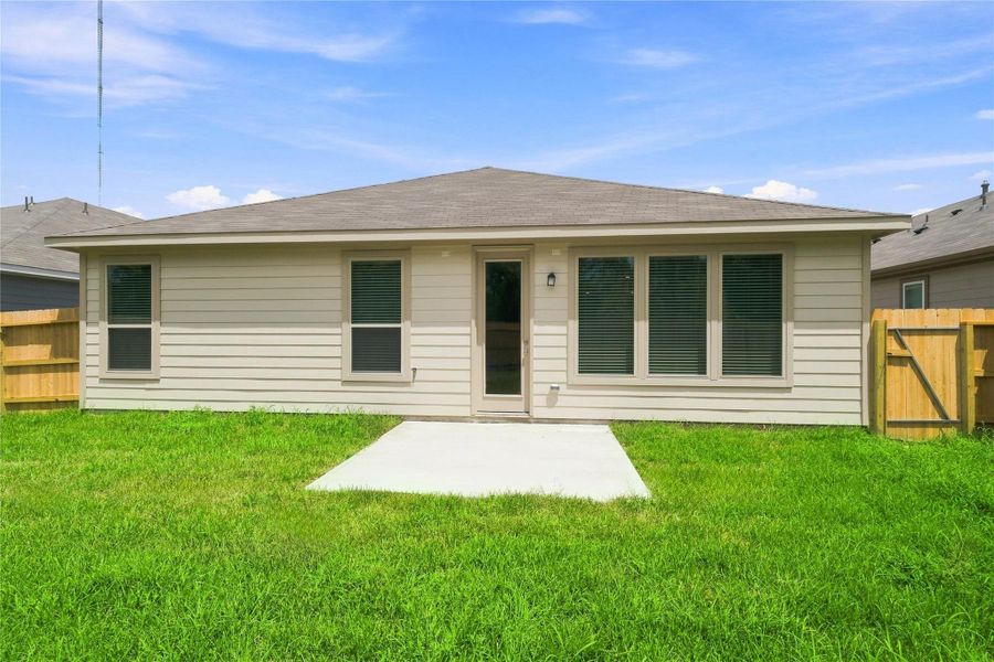 Come explore this generous backyard with patio slab—perfect for kids to play freely and adults to unwind in comfort!