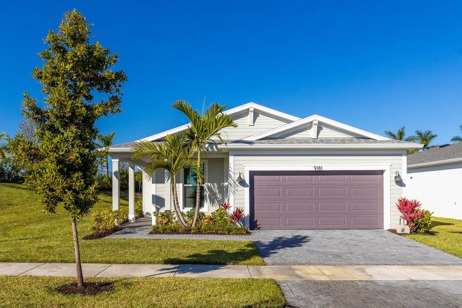 Front exterior of a new home in , Port St. Lucie, FL, highlighting curb appeal (Image 2).