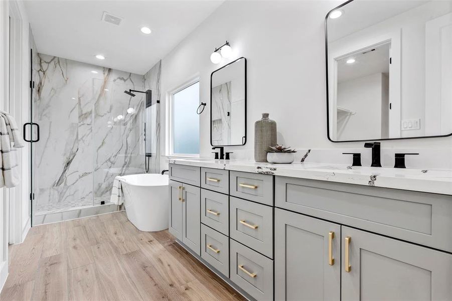 Welcome to your en-suite primary bathroom. Modern fixtures and finishes provide a touch of elegance, offering a tranquil haven for relaxation.