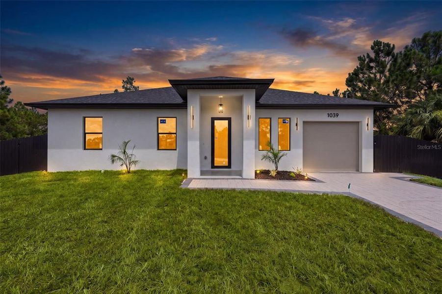Front exterior of a new home in , Lehigh Acres, FL, highlighting curb appeal (Image 23). Front exterior of a new home in , Lehigh Acres, FL, highlighting curb appeal (Image 23).