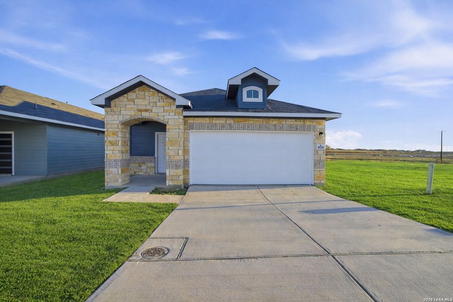 Front exterior of a new home in Garden Grove, San Antonio, TX, highlighting curb appeal (Image 18).