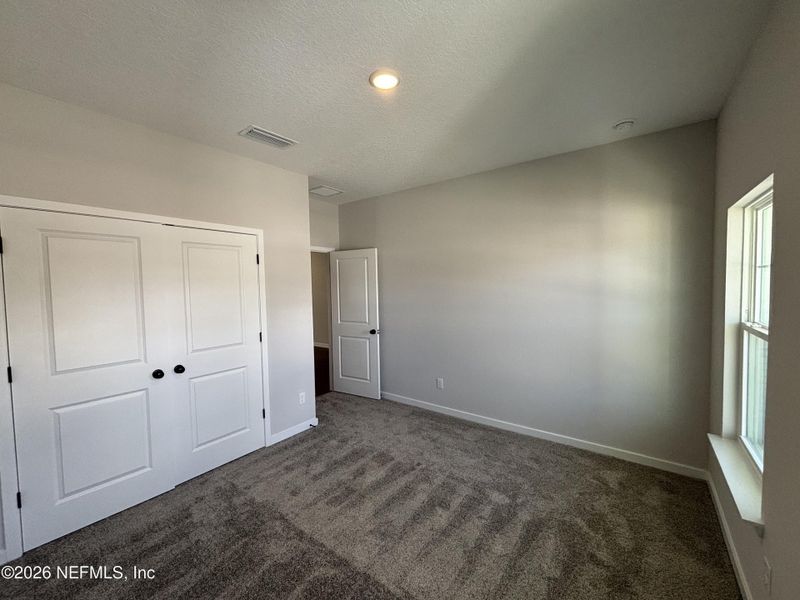 Spacious, unfurnished interior of a new home in The Cypress Series at Reserve East, Flagler Beach (Image 11).
