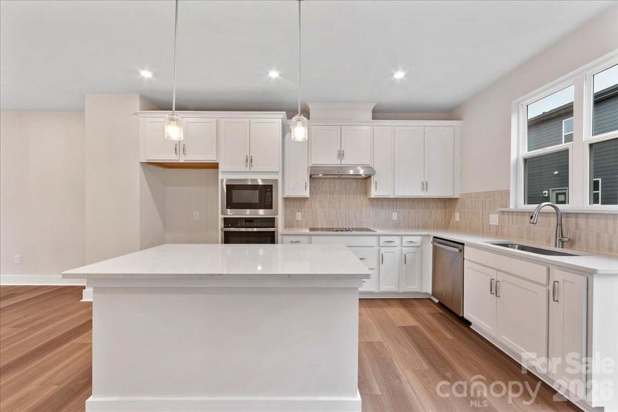 Gourmet Kitchen with Ample Lighting