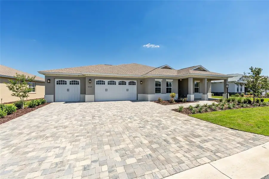 Front exterior of a new home in , Ocala, FL, highlighting curb appeal (Image 22).