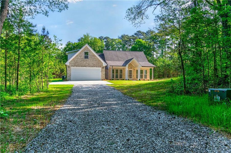 Front exterior of a new home in , Locust Grove, GA, highlighting curb appeal (Image 24).