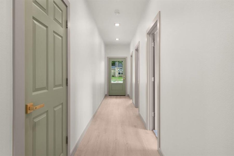 Hall featuring light wood-type flooring, recessed lighting, and baseboards