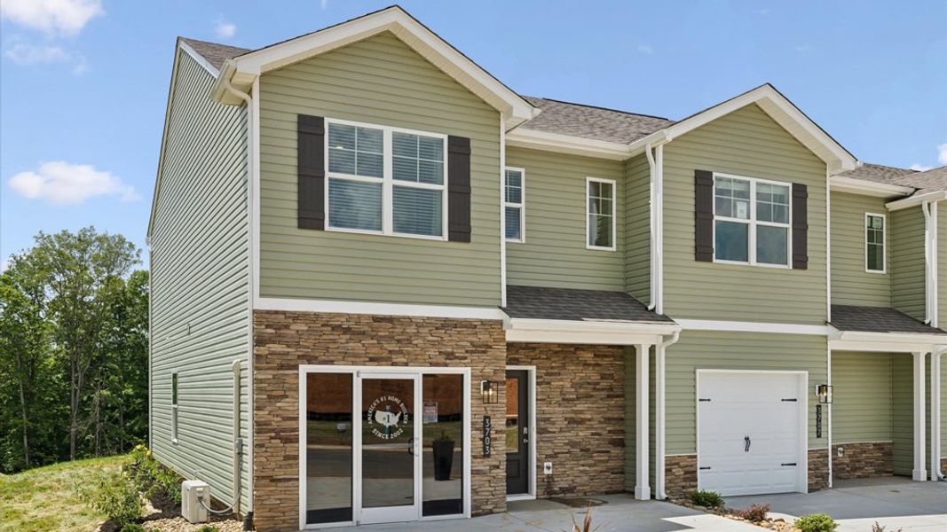 Representative exterior photo of a completed home built from the Altamont Townhome by D.R. Horton in Saint Marc's, Powell, TN (Image 1).