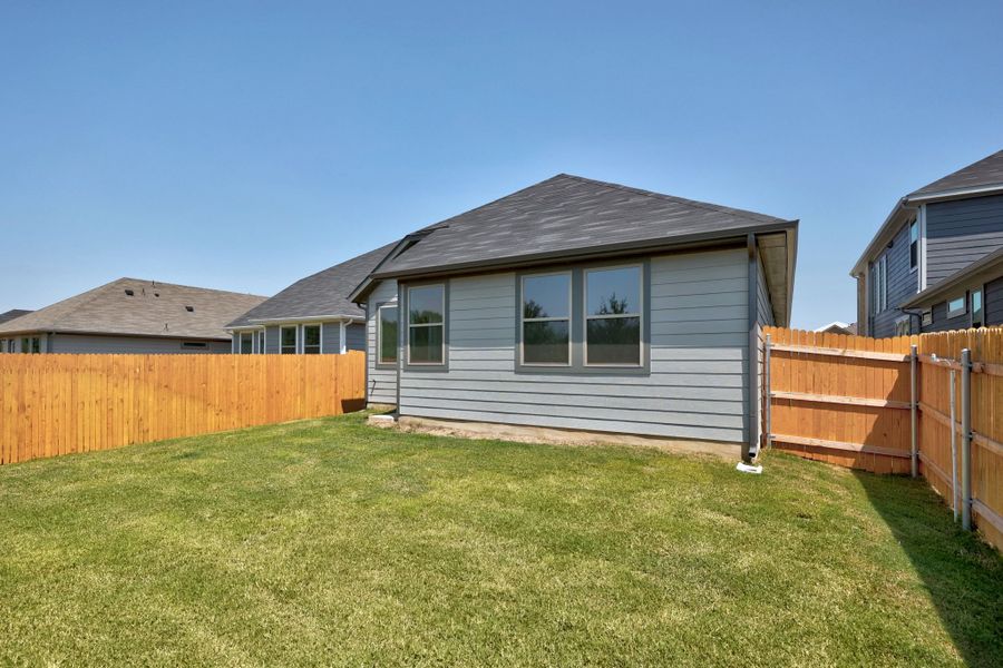 Exterior details and patio area of a home in Trinity Ranch, Elgin (Image 23).