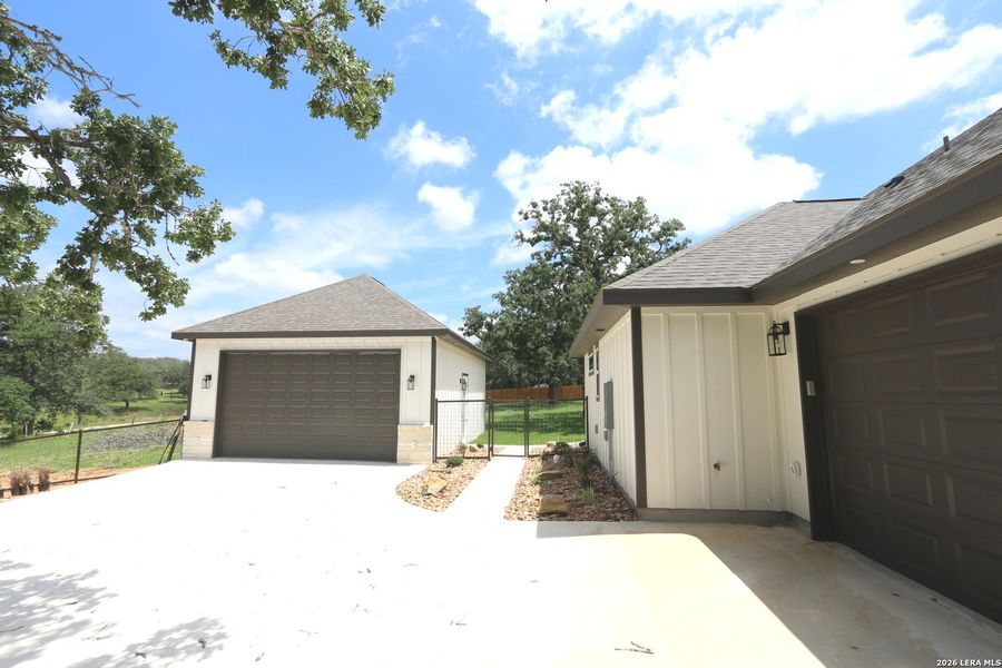 Front exterior of a new home in , La Vernia, TX, highlighting curb appeal (Image 29).