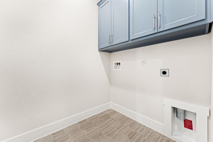 Laundry area with electric dryer hookup, cabinets, gas dryer hookup, and hookup for a washing machine