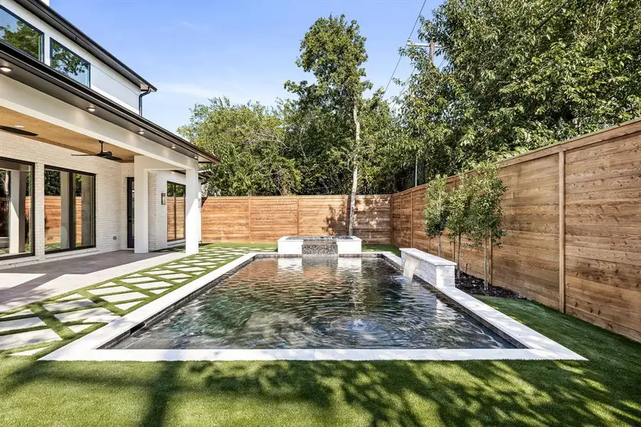 Fenced backyard with a patio area and ceiling fan Fenced backyard with a patio area and ceiling fan