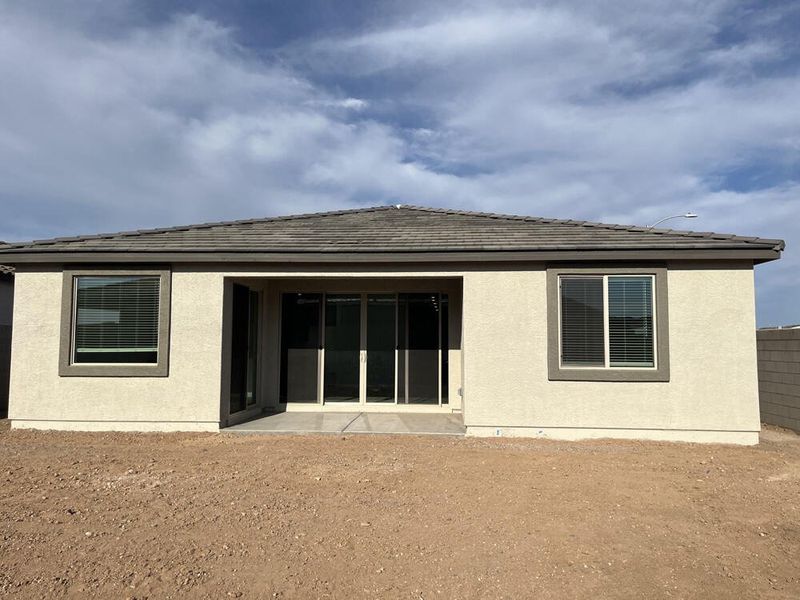 Back of home with covered patio