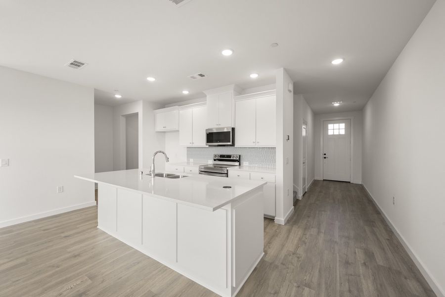 Furnished interior view inside a new home in Wildridge, Oak Point (Image 5).