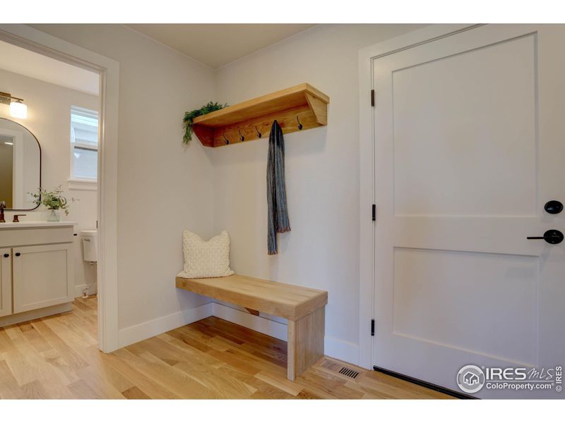 Garage entry with bench. Easy access to the kitchen and half bathroom