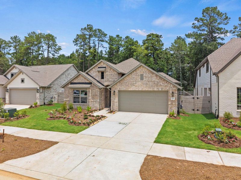 Front exterior of a new home in Two Step Farm, Montgomery, TX, highlighting curb appeal (Image 19). Front exterior of a new home in Two Step Farm, Montgomery, TX, highlighting curb appeal (Image 19).
