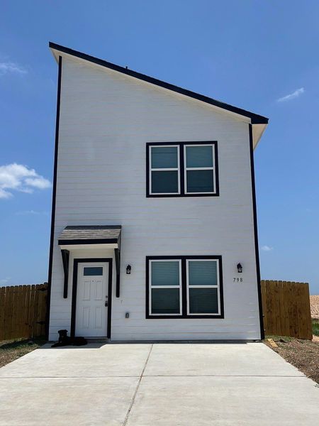 Front exterior of a new home in , Cleveland, TX, highlighting curb appeal (Image 1). Front exterior of a new home in , Cleveland, TX, highlighting curb appeal (Image 1).