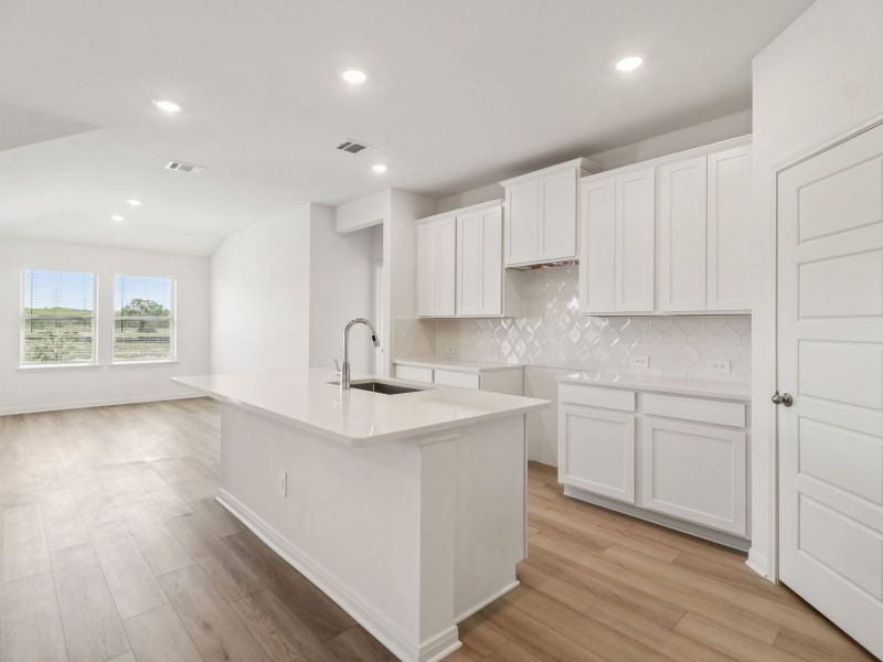 Kitchen in the Callaghan floorplan at a Meritage Homes community. Kitchen in the Callaghan floorplan at a Meritage Homes community.