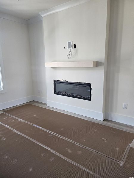 Photo of actual home to purchase, home still under construction, electric fireplace Photo of actual home to purchase, home still under construction, electric fireplace
