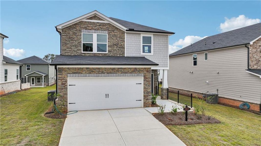 Exterior details and patio area of a home in Martin Springs - Reserve Series, Lawrenceville (Image 2).