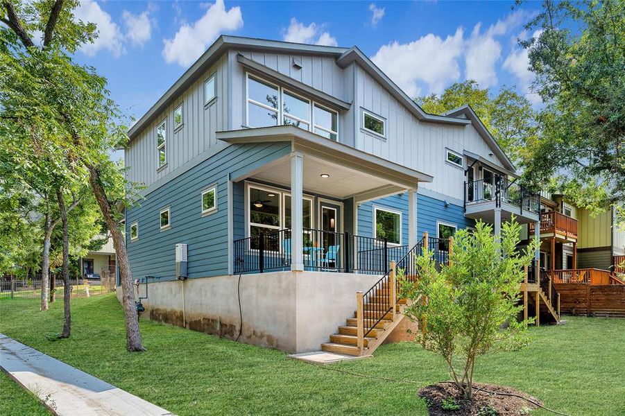 Step into the peaceful backyard retreat, offering sunset views and surrounded by nature's beauty. Privacy provided by a wrought iron and wooden fence which was not installed at time of photos.