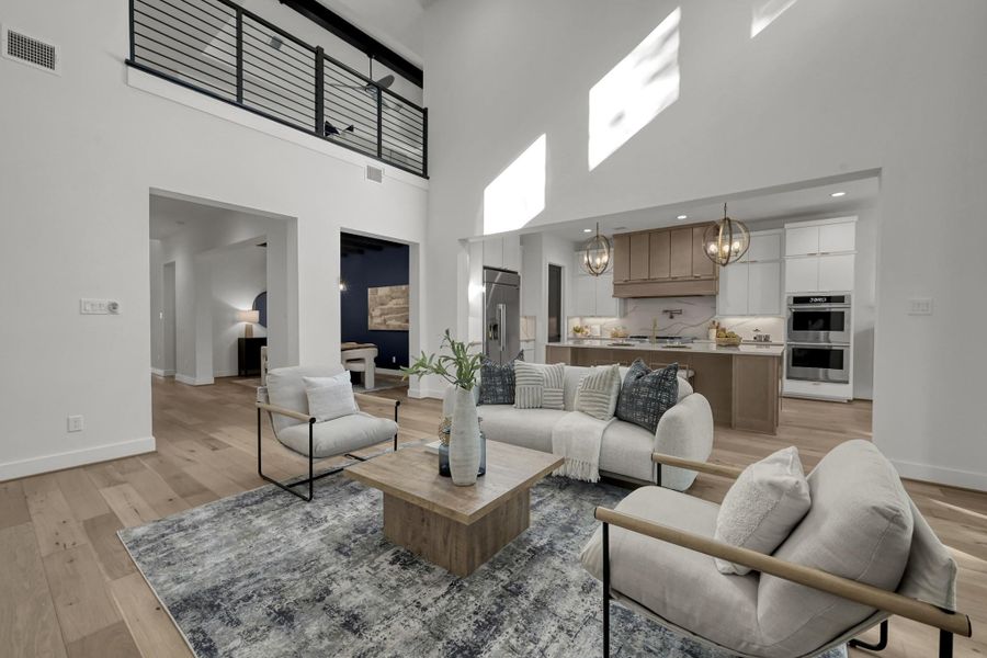 Alternate view of the living room showing the high ceiling design. Alternate view of the living room showing the high ceiling design.