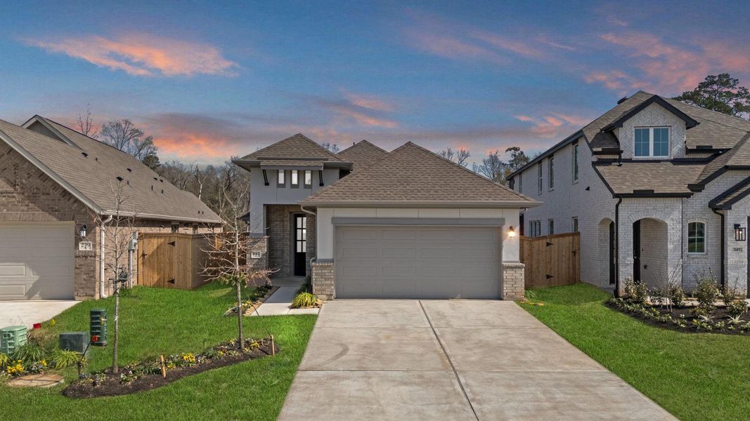 Front exterior of a new home in Grand Central Park, Conroe, TX, highlighting curb appeal (Image 2). Front exterior of a new home in Grand Central Park, Conroe, TX, highlighting curb appeal (Image 2).