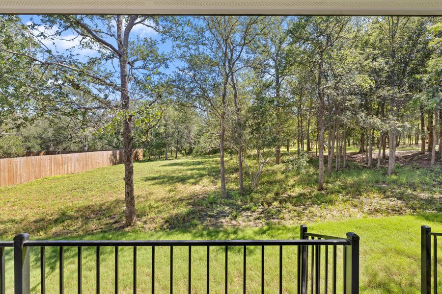 Enjoy tranquil woodland views and a spacious yard from this inviting outdoor area. Enjoy tranquil woodland views and a spacious yard from this inviting outdoor area.
