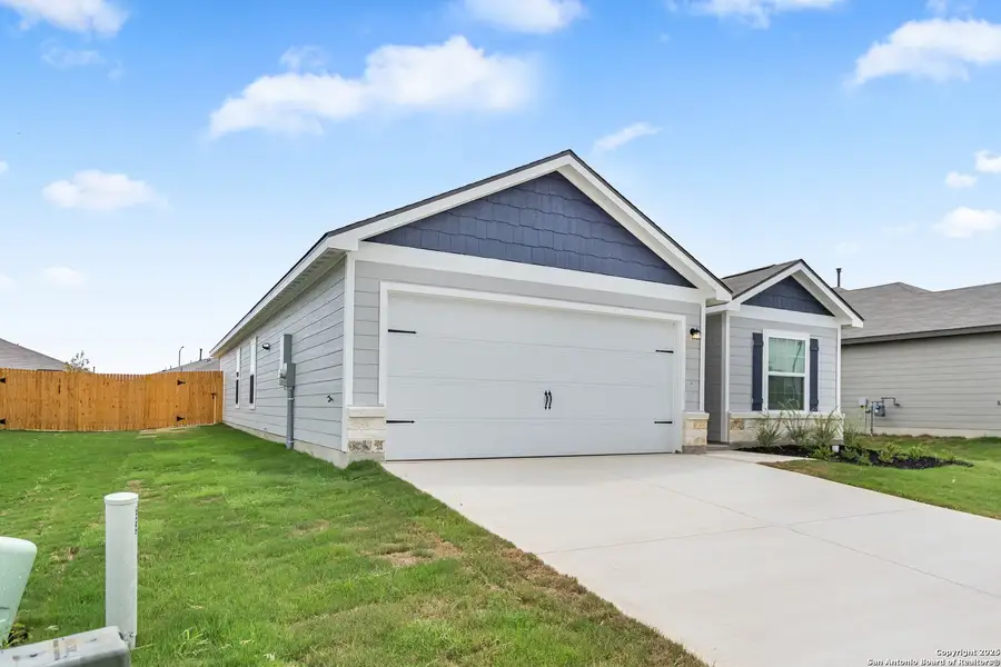 Front exterior of a new home in Luckey Ranch, San Antonio, TX, highlighting curb appeal (Image 1).