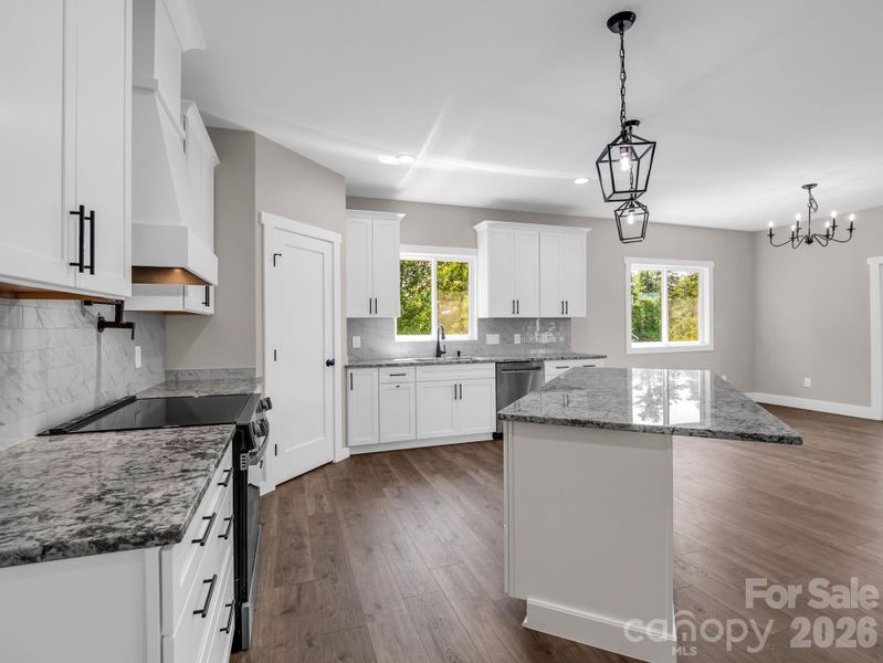 Chef's kitchen with granite counters and stainless appliances (convection electric oven, microwave drawer and dishwasher), stainless appliances, soft close cabinets and large walk-in pantry. Chef's kitchen with granite counters and stainless appliances (convection electric oven, microwave drawer and dishwasher), stainless appliances, soft close cabinets and large walk-in pantry.