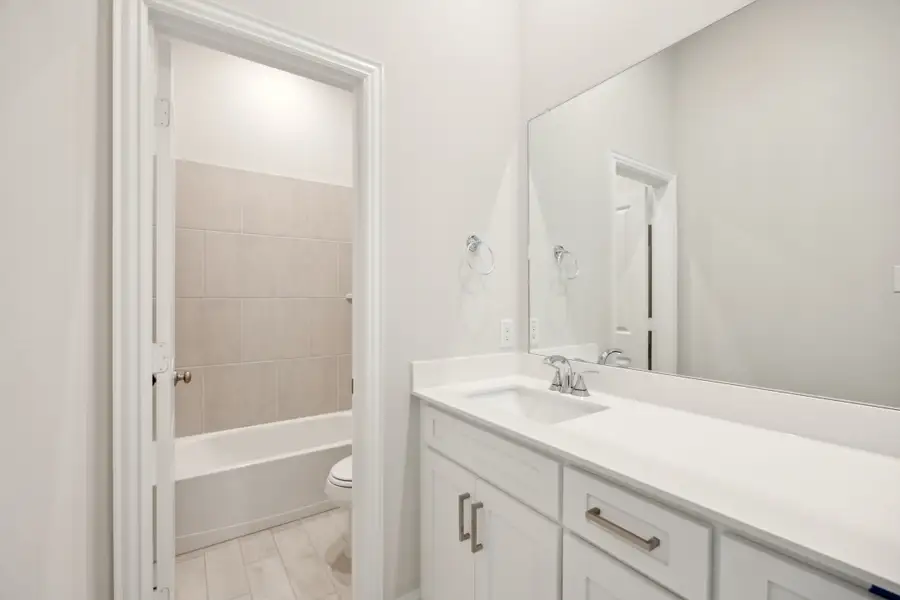 Representative furnished interior of a home built from the Waverly III by Megatel Homes in Bellagio, Forney (Image 7).