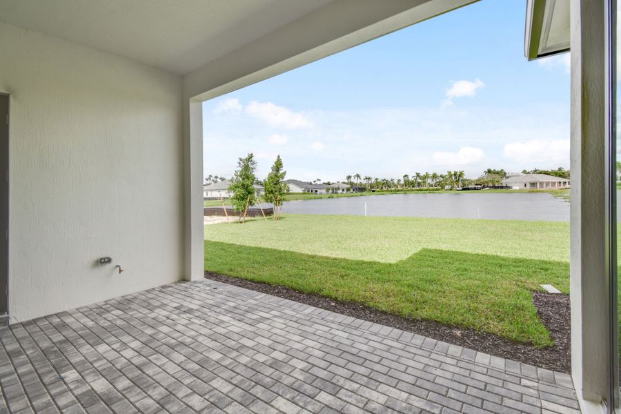 Exterior details and patio area of a home in Greyhawk Landing, Lake Worth (Image 4).