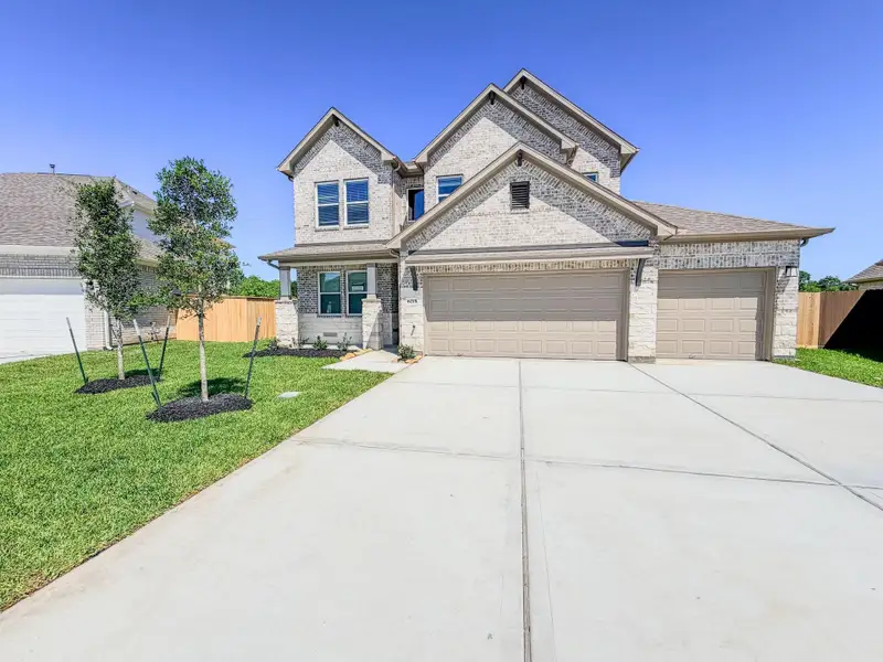 Front exterior of a new home in Foxtail Palms, Manvel, TX, highlighting curb appeal (Image 19).